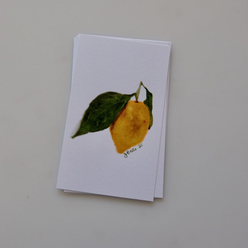Lemon and leaf watercolor illustration on a white card, showcasing artistic botanical design.